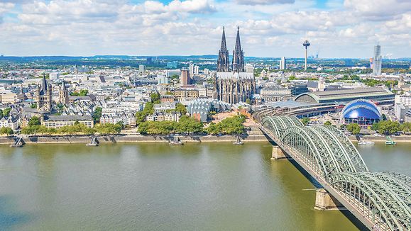 Federal State North Rhine-Westphalia, Germany - Aerial view of cityscape of Cologne with Hohenzollern bridge, cathedral and Saint Martin church.